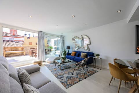 Main view of the living room space with access to the terrace