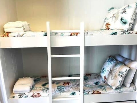  Fun and functional bunk beds with playful sea-life bedding.