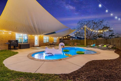 Backyard oasis with Edison lights and private pool 