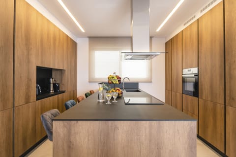 The rough-luxe kitchen is well-equipped for a self-catering stay.