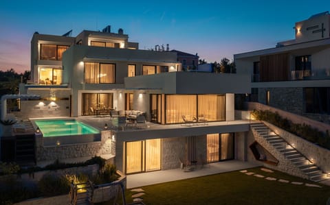 A view of the luxurious, modern Villa Murter Glory on the island of Murter with a heated pool and outdoor terraces