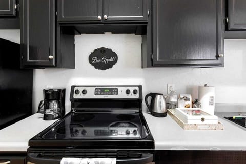 Full Kitchen includes all pots, pans, silverware, coffee maker, coffee, sugar, creamer, tea, blender, toaster, refrigerator, microwave, glasses, wine glasses and cooking/eating utensils