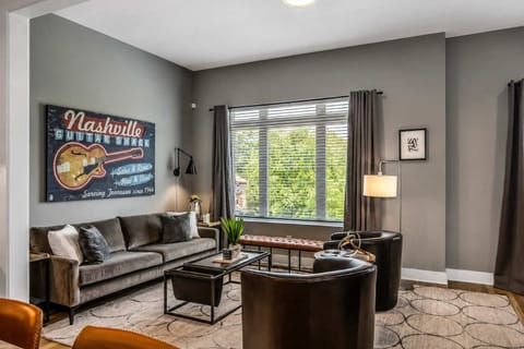 Elegant living room on Level 2, bathed in natural light with comfortable seating.