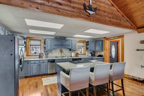Spacious kitchen with bright atmosphere, island, and modern features.