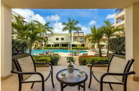 A ground floor porch to enjoy the pool view.