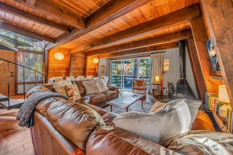 Living Room: Smart TV, fireplace, sectional seating