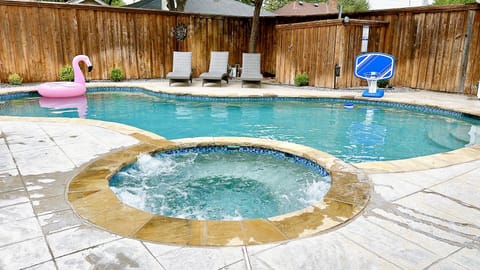 Dive into relaxation at our backyard oasis – your perfect escape awaits! 