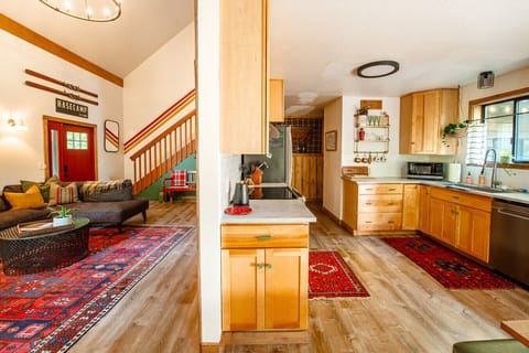 View of the flow of the living room and kitchen. You never need to be too far from the action.