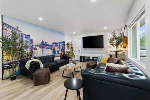 Italy inspired design with leather couches and 75` TV