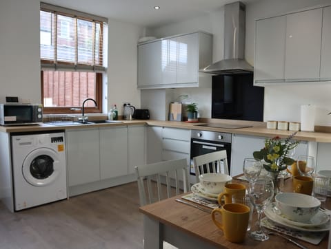 Standard Townhome | Private kitchen | Electric kettle, highchair, dining tables