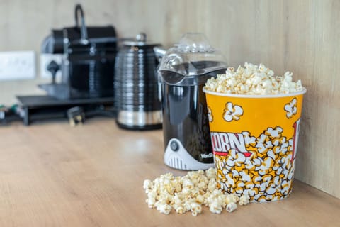 Popcorn maker & popcorn ready for your movie night on the 50 inch Smart TV