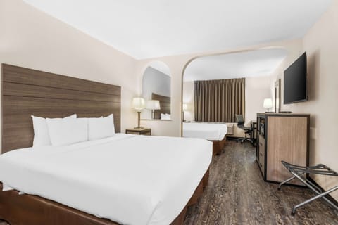 Room, Multiple Beds | Individually furnished, desk, laptop workspace, iron/ironing board