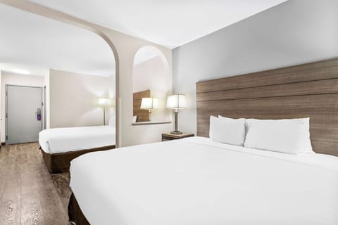 Room, Multiple Beds | Individually furnished, desk, laptop workspace, iron/ironing board