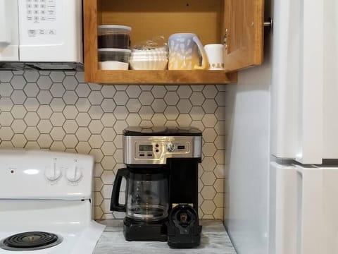 Hamilton Flex Brew will brew grounds or k-cups; ground coffee, filters provided