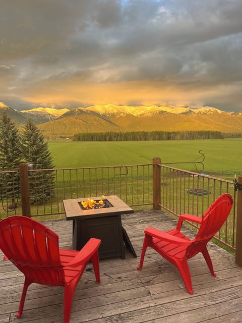 Expansive views from the deck. Enjoy comfortable seating and propane fireplace.