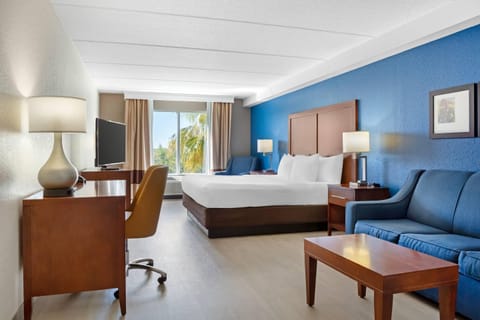 Suite, 1 King Bed, Non Smoking | Desk, laptop workspace, blackout drapes, iron/ironing board