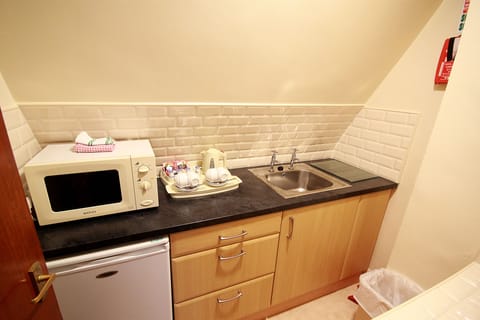 Standard Family Room | Private kitchen | Coffee/tea maker, electric kettle, highchair