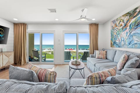 Steps from the patio in this first floor condo, enjoy lovely views and waves calling you.