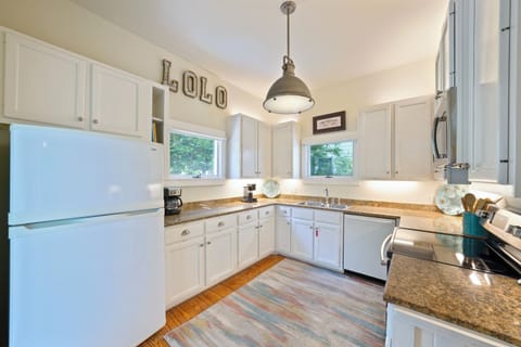 ADJACENT KITCHEN W/GRANITE COUNTERS  & PLENTY OF CABINETS
