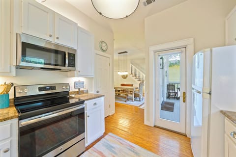 KITCHEN ALTERNATE VIEW TO DINING AND REAR PORCH ACCESS