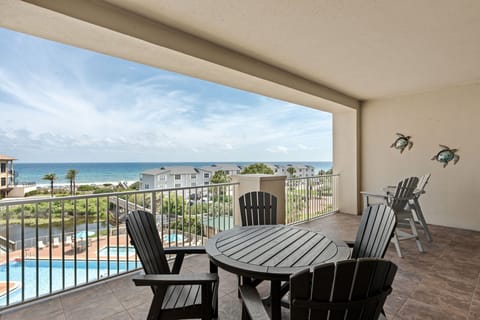 Sip your morning coffee on your private balcony while soaking in breathtaking views of the Gulf, pool, and dunes—a serene escape where coastal beauty surrounds you.