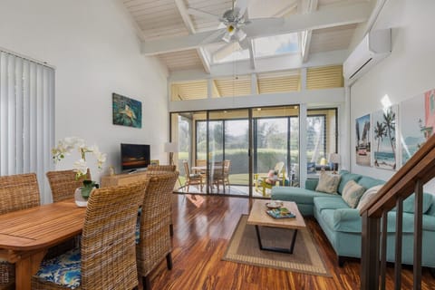 ChatGPT said:  Bright living area w/ soaring ceilings & sliding doors opening to breezy lanai.