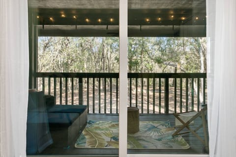 Great Views of the Woods through the Sliding Patio Door to the Balcony