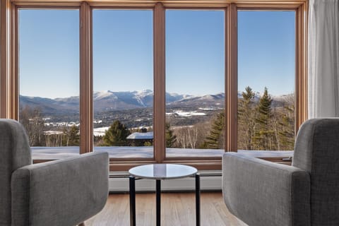 Enjoy the amazing view of Mt. Mansfield from the cozy chairs in the living room.