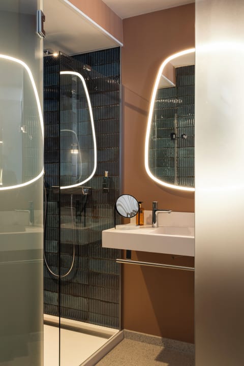 Shower, hair dryer, slippers, towels