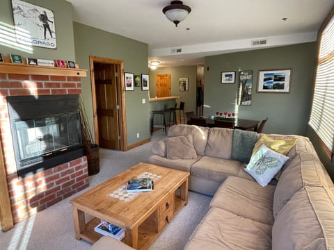 relax in the spacious living room w/ gas fireplace
