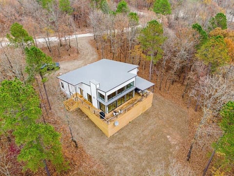 Charming Retreat: Experience nature from the spacious deck of this beautifully designed home!