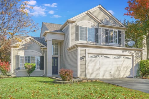 Exterior view of the house - enjoy cornhole and a picnic table in the backyard!