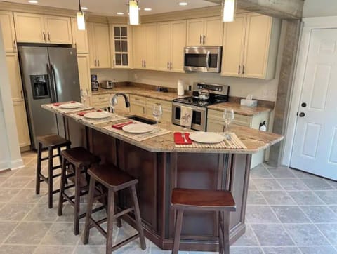 Fully stocked kitchen with breakfast bar