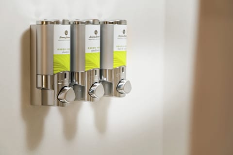 Designer toiletries, hair dryer, bathrobes, towels