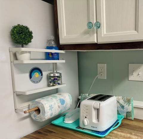 Dishwasher pods, dishwashing liquid, and paper towels for your convenience.