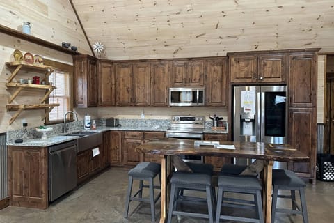 Large open concept kitchen area with dining for family and friends.