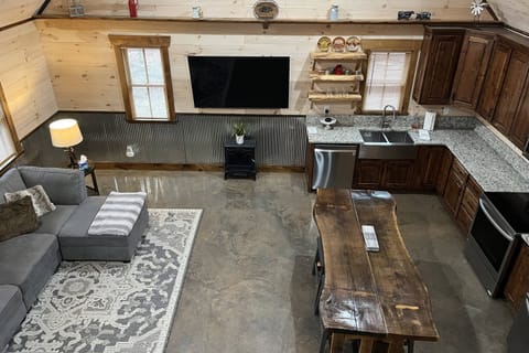 There is seating for six at the kitchen table, and additional seating outside on the screened porch and deck