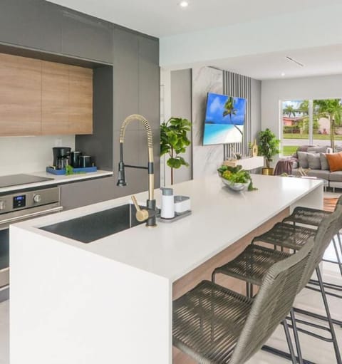 Sit up at the sleek stone breakfast bar for a coffee with seating for four