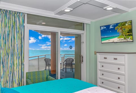 Primary bedroom with balcony access