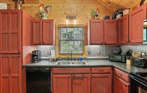 Full kitchen with unique red cabinets