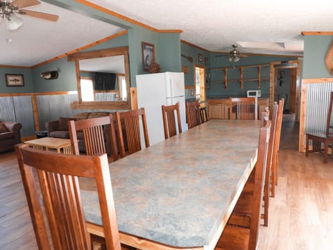 Dining, living room, kitchen areas.