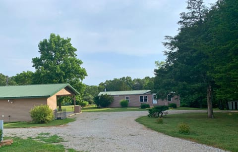 Front of home, pavilion and yard