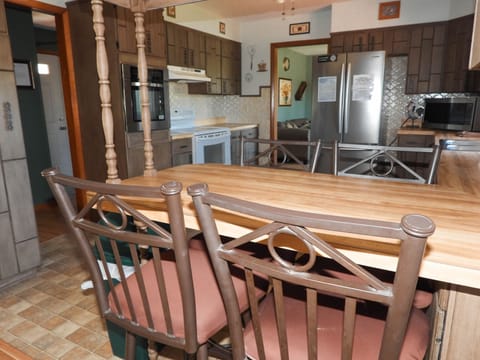 Bar with stools upstairs.