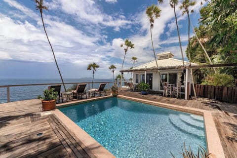 Spend days lounging poolside while listening to the rhythm of the sea 