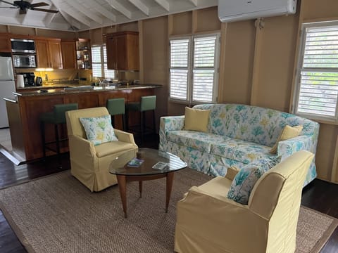 Spacious open concept living room area that flows nicely into the kitchen area .