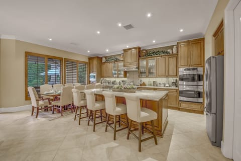The fully-equipped gourmet kitchen features stunning stainless steel appliances!