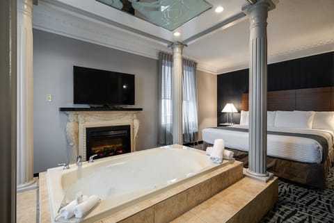 Luxury King Suite with Jetted Tub | Down comforters, desk, iron/ironing board, free WiFi