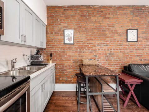 Kitchen has seating for dining and work.
