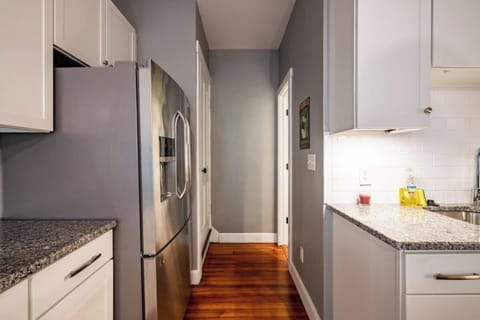 The hall leads to full bath and private stairs to 2 upstairs bedrooms