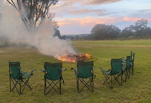 Enjoy the sunset around the firepit. Camp chairs supplied.
